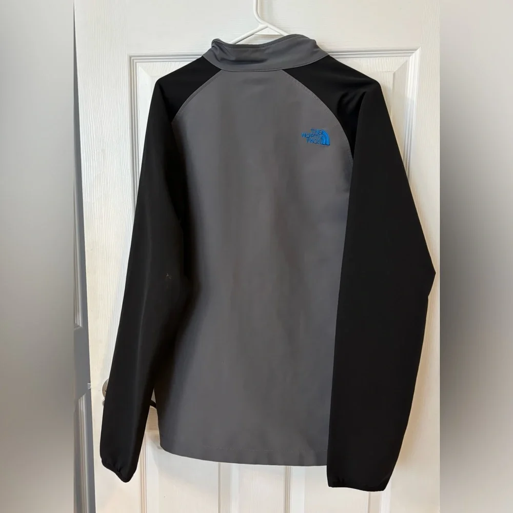 The North Face Men’s Gray Softshell‎ Jacket with Black Sleeves and Blue Trim